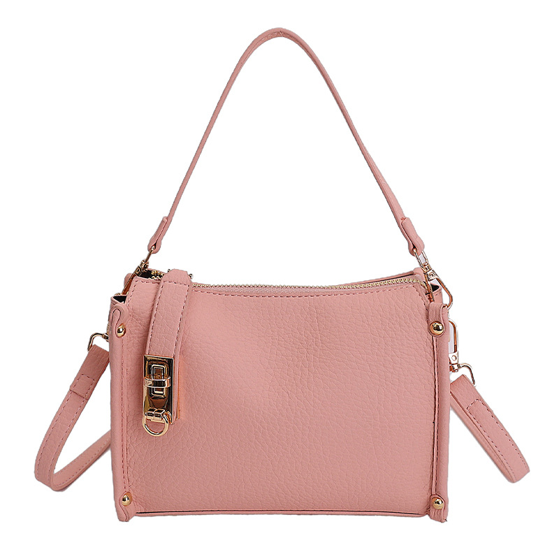 Nicho Zhong textura bolso de mujer 2026 nuevo remaches de gran capacidad simple de hombro simple bolso de brazo de viaje