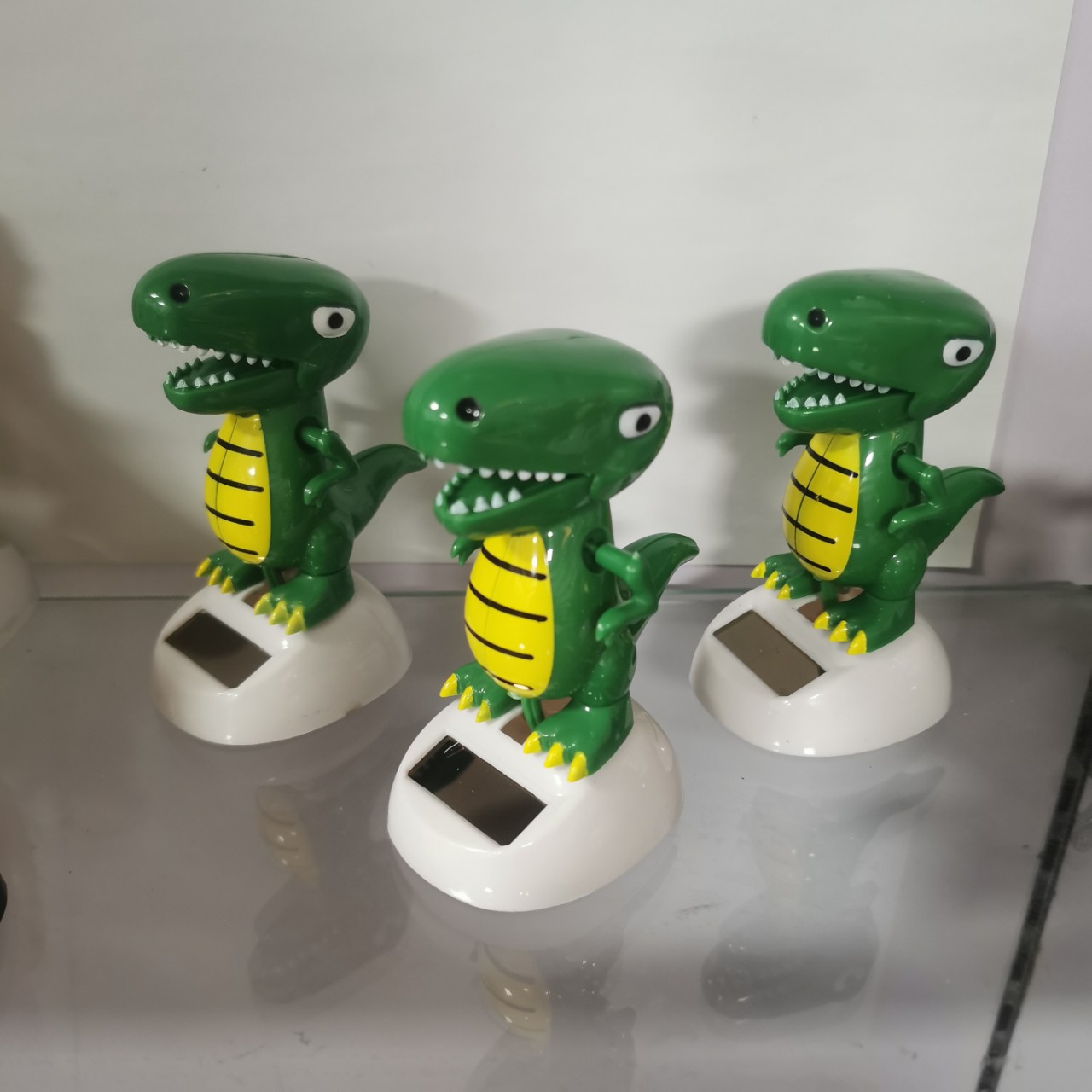 Factory supply creative new solar Apple flower car interior decoration toy solar doll dinosaur