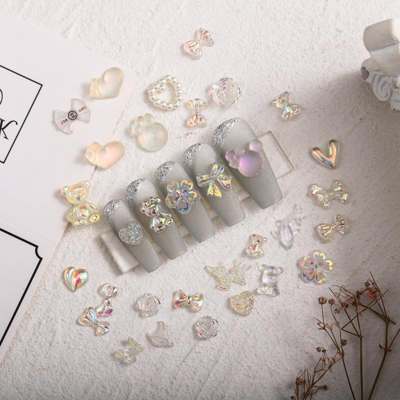 Cross-border nail Bow accesorios Diamond 100 mezcla de resina hecha a mano Rosa tridimensional negro blanco Aurora