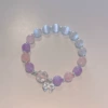 Purple bracelet with bow, cat's eye