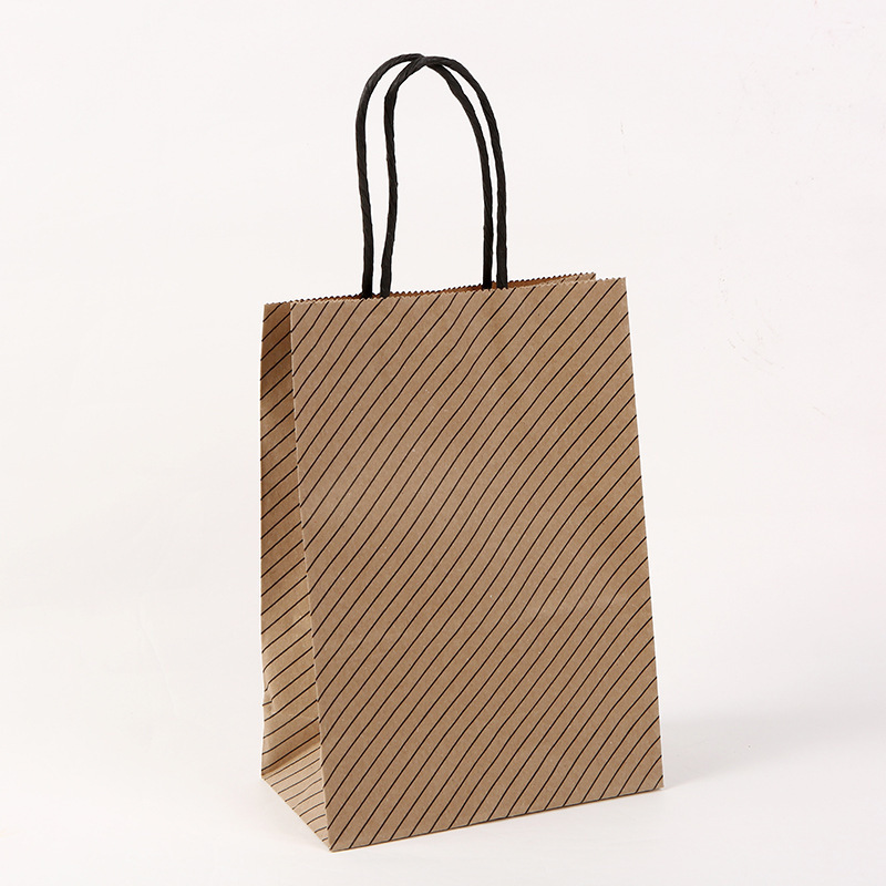 Bolsas de regalo de la serie de papel kraft con rayas onduladas y lunares, bolsas de mano para empaque de té con leche, venta directa de fábrica de papel kraft
