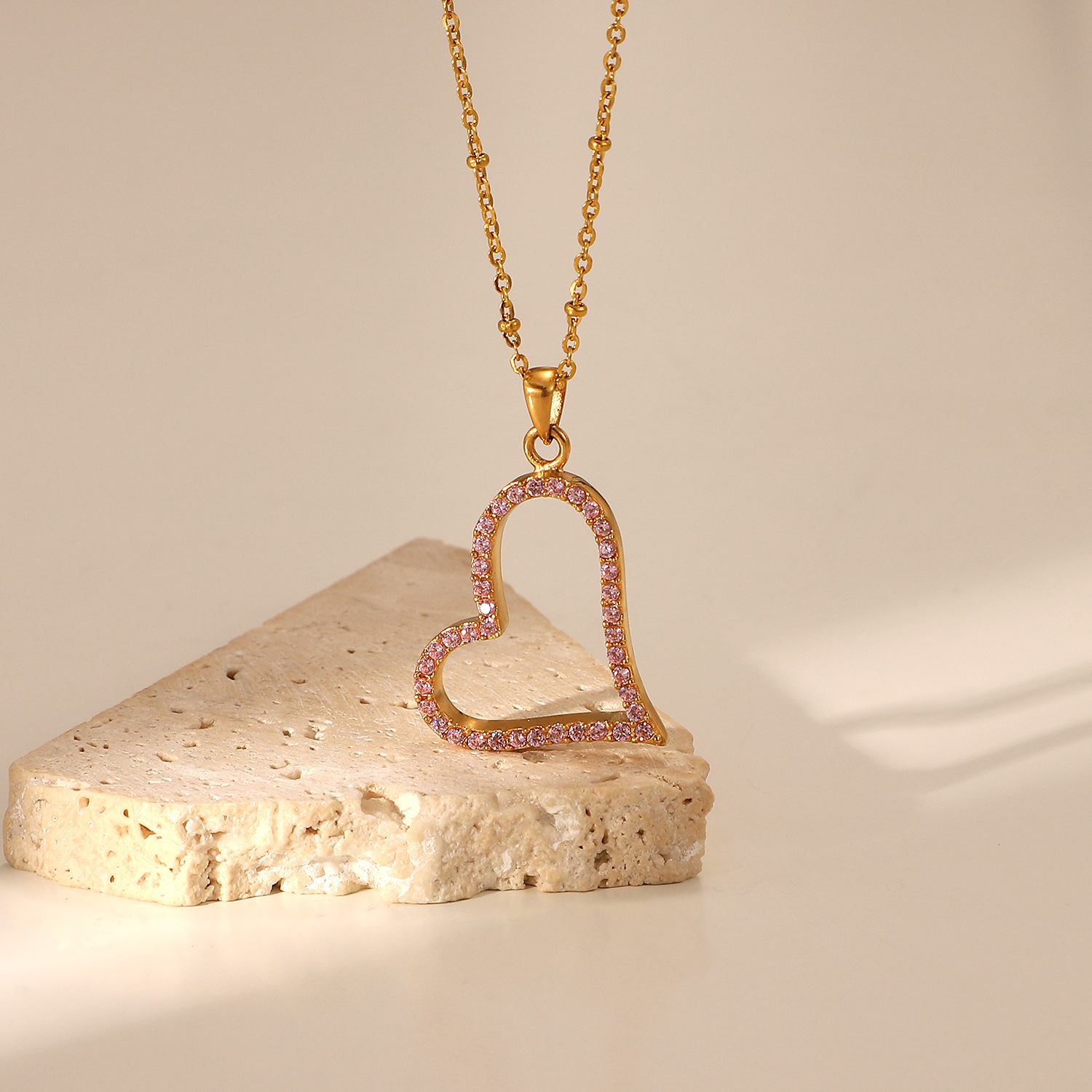 European And American Titanium Steel Irregular Hollow Love Pink Micro Zirconium Edge Pendant Necklace display picture 2