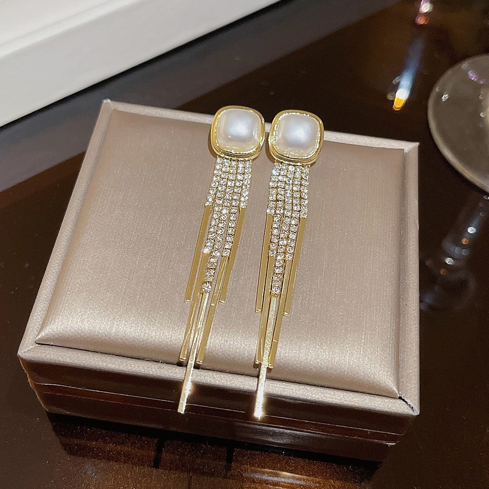 S925 aguja de plata elegante borla pendientes de alta gama simple cara de adelgazamiento pendientes de todo fósforo estilo coreano nuevos pendientes de moda al por mayor