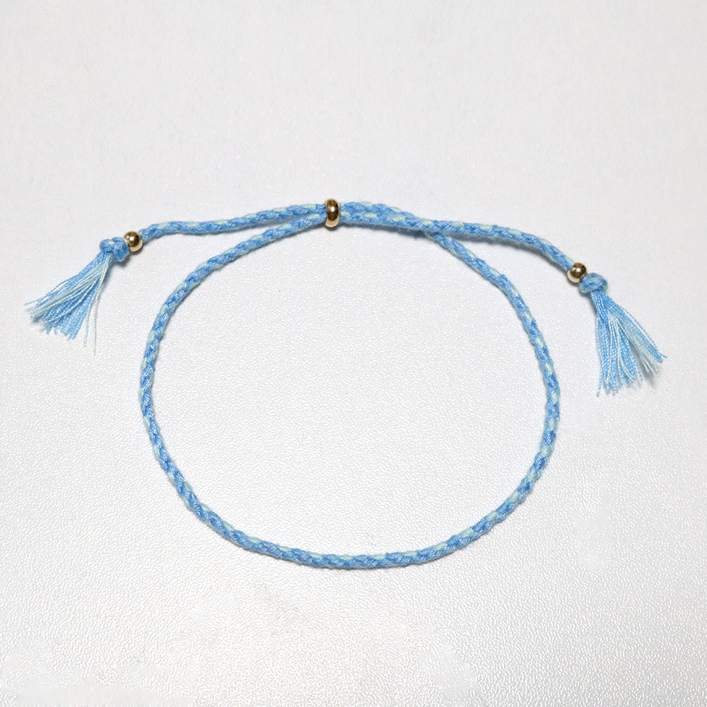 Amazon popular colorido cuerda de algodón amistad pulsera perlas de cobre borla pulsera tejida a mano ajustable hombres y mujeres pulsera