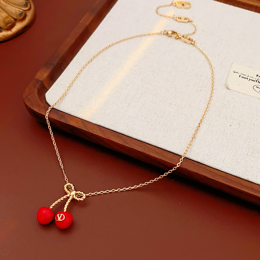 Aguja de plata, arco, letras de cereza, pendientes, collares frescos y dulces, cadenas de clavícula, temperamento de nicho, joyería femenina, sentido superior.