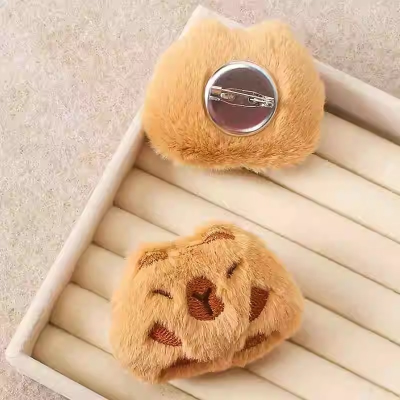 Capibara peluche pequeño colgante bolso muñeca broche muñeca adorable muñeca máquina peluche accesorios bolsas de pluma al por mayor