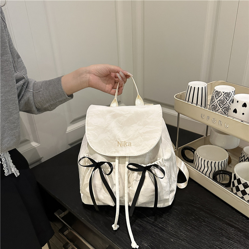 Mochila de lazo de sentido de alta gama para mujer 2025 nueva moda mochila de viaje mochila escolar casual para estudiantes coreanos