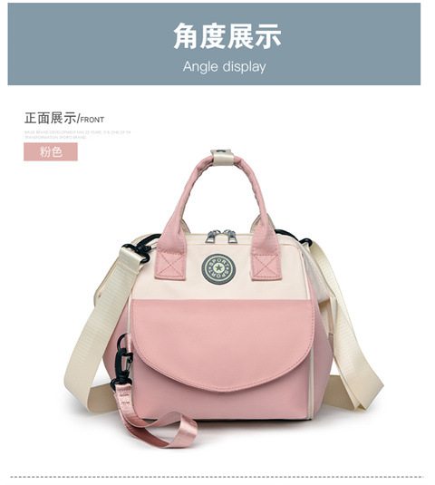 The Mommy bag is small and cute. It has a detachable front pocket and is a multi-functional baby bag. It is waterproof, lightweight, and has a crossbody design. It can be used to carry milk bags undefined