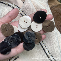 Buttoned coat, sweater, beige buttons, marble pattern, black dress buttons, irregular, formal, woolen trench coat buttons
