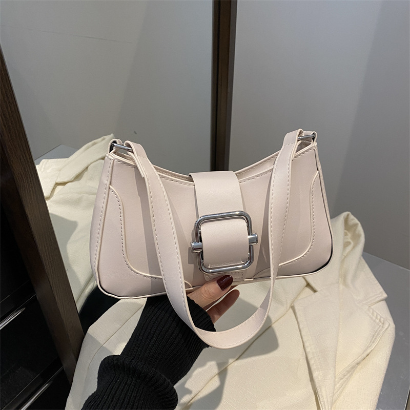 Versión coreana del bolso de axila de alta gama, popular de este año, bolso de palo francés de estilo occidental, diseño de nicho, bolso de hombro de temperamento de moda, viaje