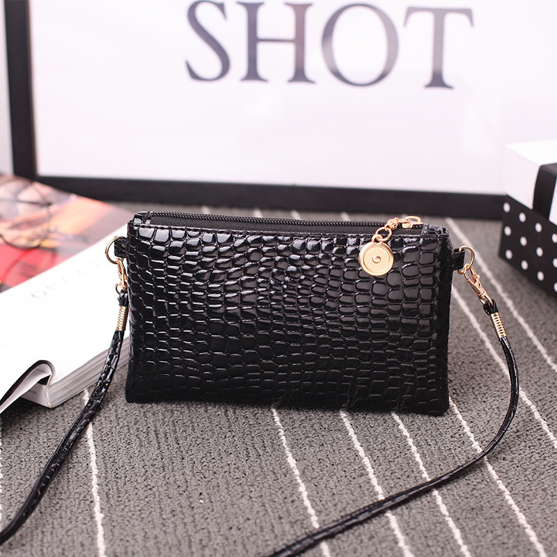 Una bolsa de mujer, bolso de moda 2024 bolso de hombro de mujer, bolso de tela de cocodrilo, bolso de cambio de teléfono móvil
