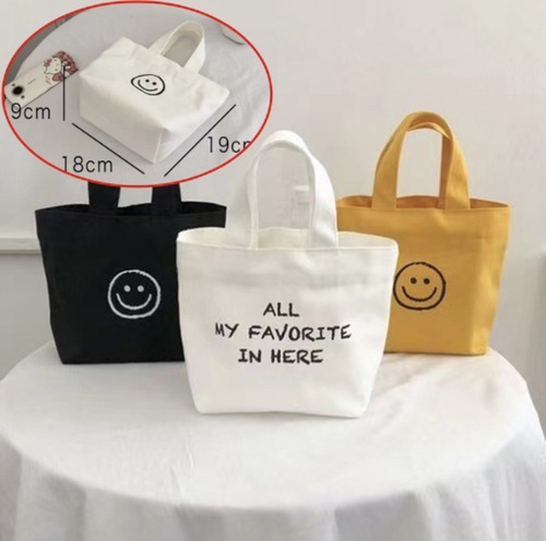 帆布包包新款可爱笑脸手提袋简约百搭便当包文艺小清新包包女