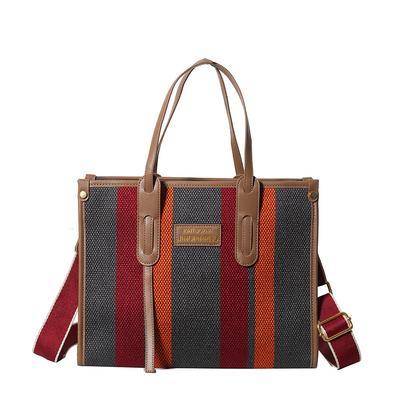Bolso Tote portátil a rayas de color de contraste de lona para mujer 2024 nueva textura de moda transfronteriza bolso de mensajero de un solo hombro