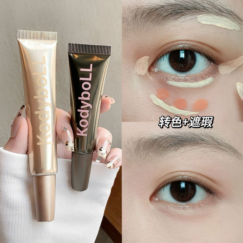 Kodyboll bicolor eye concealer líquido ligero hidratante para cubrir los círculos oscuros de los ojos, ranura de lágrimas impermeable para mantener el maquillaje concealer