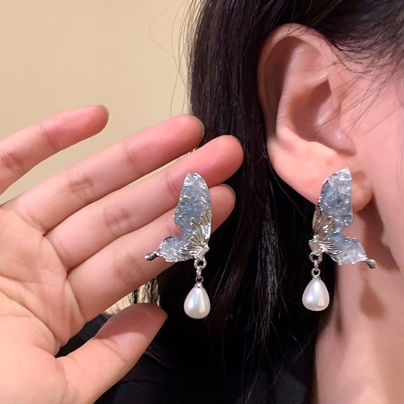 Diseño de nicho de alta gama borla larga sin orejas clip de oreja elegante estilo occidental de las mujeres cara-mirando pequeños nuevos pendientes de moda