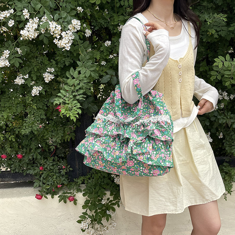 Bolsa de lona de flores coreana diaria para mujeres verano 2026 nueva moda encantadora niña brazo bolso de hombro