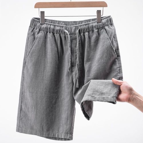 Summer lightweight khaki cotton-linen capri pants for men: solid-color, loose-fit, straight-leg design with elastic waistband—perfect for casual beach wear.