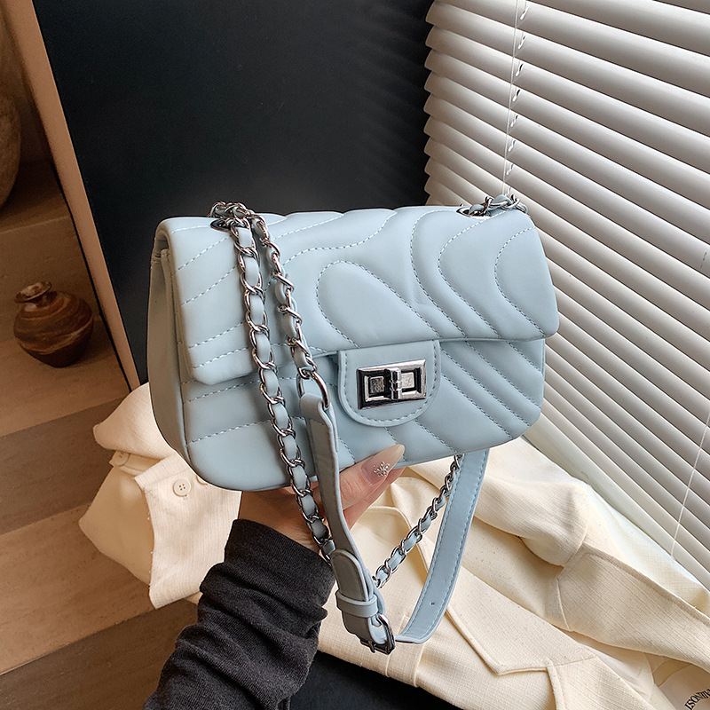 Bolsos de cadena de moda de comercio exterior para mujer 2025 nuevo bolso de hombro con textura de todo fósforo de alta calidad