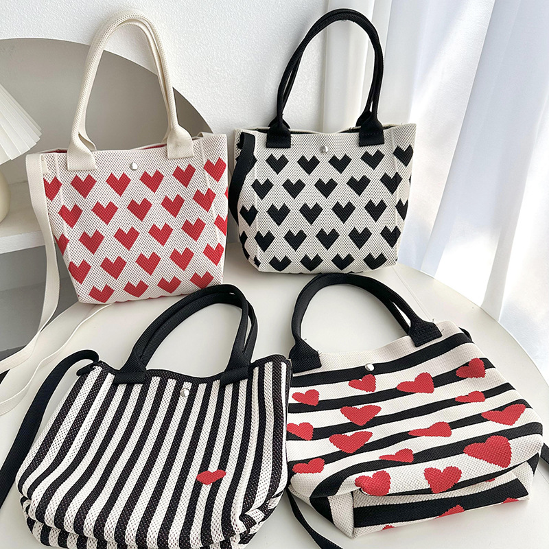 Bolsos de tejido volador Bolsos de transporte de estudiante Versión de moda Capacidad Tot 2025 Love Rayas Bolsos casuales coreanos Bolsos diagonales