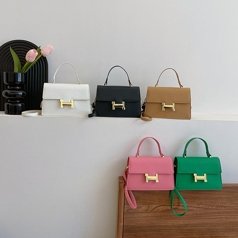 Bolso popular este año 2024 nueva textura bolso de mano cuadrado lichi patrón bolso de viaje de mujer mochila de hombro casual