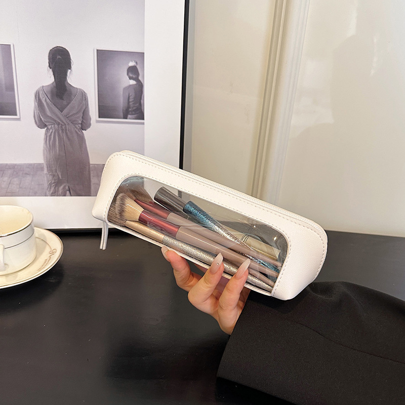 Bolsa de lápices de maquillaje de cuero de pvc Bolsa de almacenamiento de cosméticos de ventana de costura de alto valor Bolsa de lavado de viaje portátil