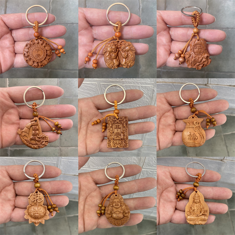 Imitation peach wood key chain carved wood bag pendant stall small commodity car key hanging wholesale a generation of hair
