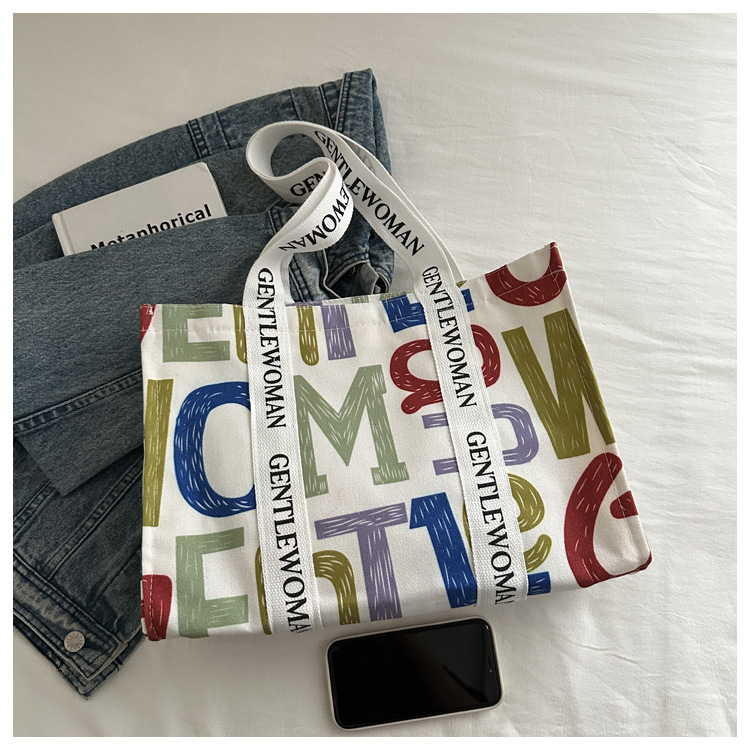 Large-capacity letter canvas bag 2025 new style ins printed versatile shoulder bag for commuting and portable ladies' tote bag undefined