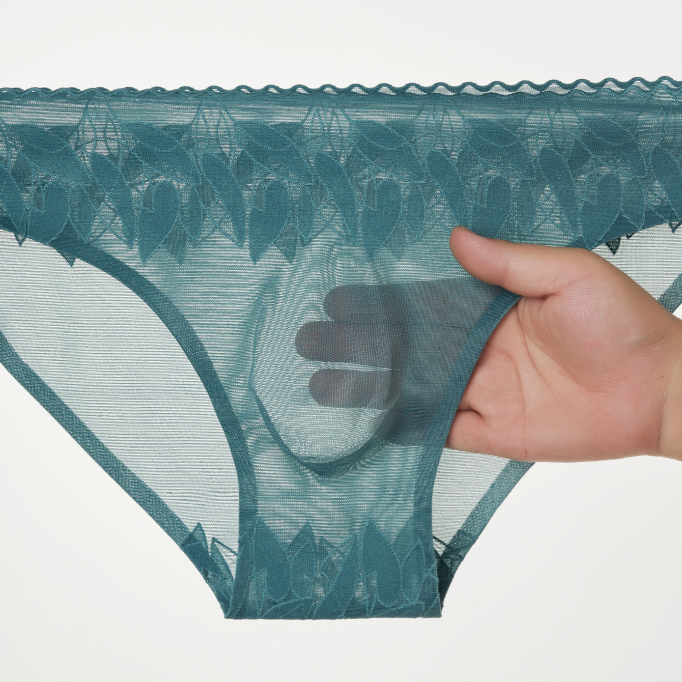 Nuevas calzoncillos de hombre elásticos de encaje 3D bolsas convexas estereoscópicas calzoncillos de hombre sin marcas