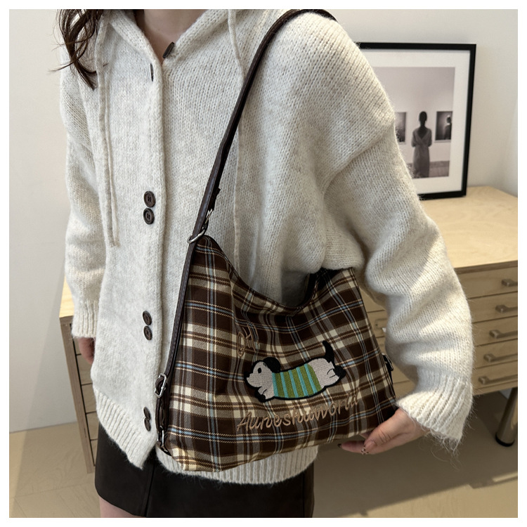 A new 2024 trendy and stylish backpack for women, featuring a cartoon checkered single-shoulder crossbody bag and a tote bag undefined