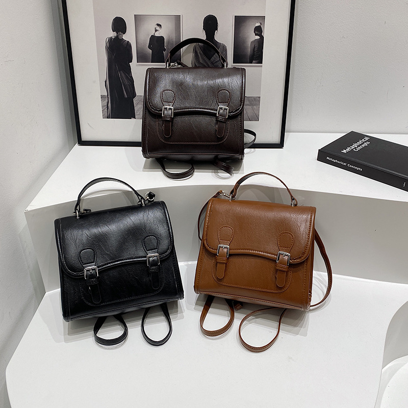 Colegio retro coreano doble hebilla estilo británico 2024 literatura y arte ocio de gran capacidad de moda textura mochila de hombro