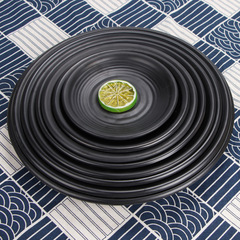 Melamine restaurant tableware: BBQ plates, porcelain-look hot pot and dish plates, plastic barbecue platters, and commercial-grade black sushi plates.