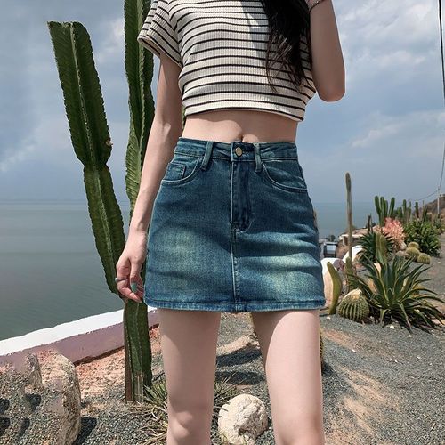 Leather-lined stretch denim short skirt for 2025, high-waisted, flattering for petite figures, showcasing a curvy silhouette.