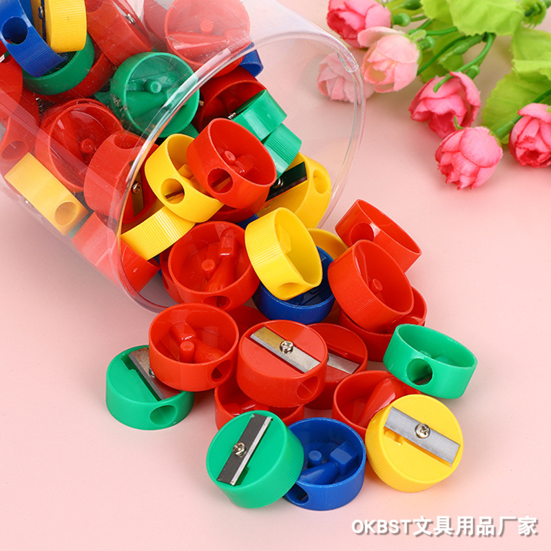 Fábrica de sacapuntas redondos geométricos Sacapuntas de lápiz redondo resistente al desgaste creativo de plástico papelería de aprendizaje