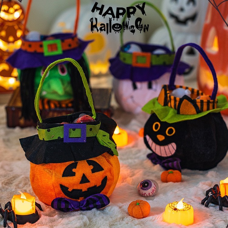 ハロウィーンのカボチャのバケツのキャンディーの袋のかごの子供の贈り物の贈り物は幼稚園の雰囲気を飾って飾っています。|undefined