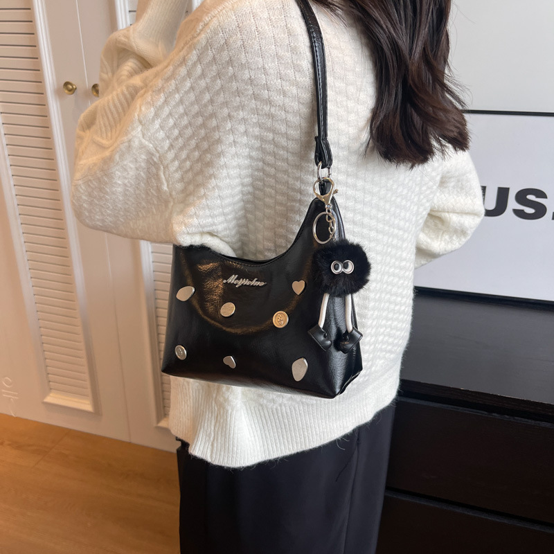 Una bolsa de brazo mayorista nueva textura bolso de mano exterior bolso de mujer de verano pequeño diseño urbano bolso de mujer simple