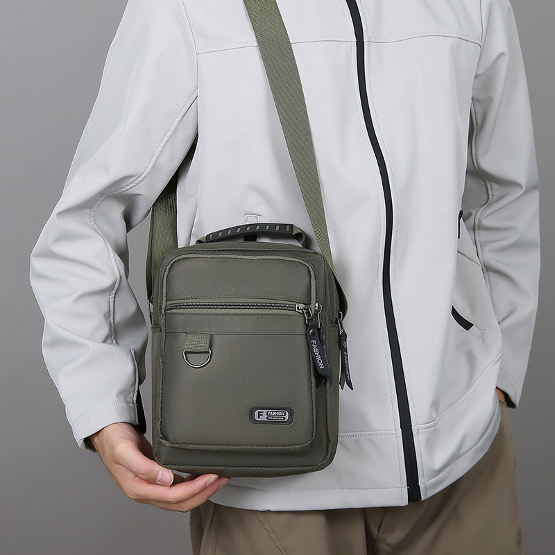 2025 nuevo bolso de moda para hombres simple ocio bolso de hombro de negocios de nylon de viaje versátil bolso de mano vertical