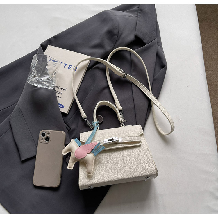 The Korean version of the hand-held small square bag for women in 2025, a new single-shoulder bag with a niche design, simple and versatile, trendy crossbody Kelly bag undefined