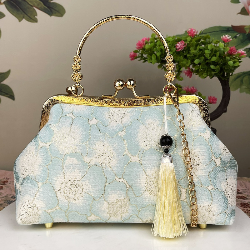 新製品のシンプルなチャイナドレスのカバンを斜めに掛けて三用のハンドバッグを使ってクロスボーダーの女性バッグを持っています。|undefined