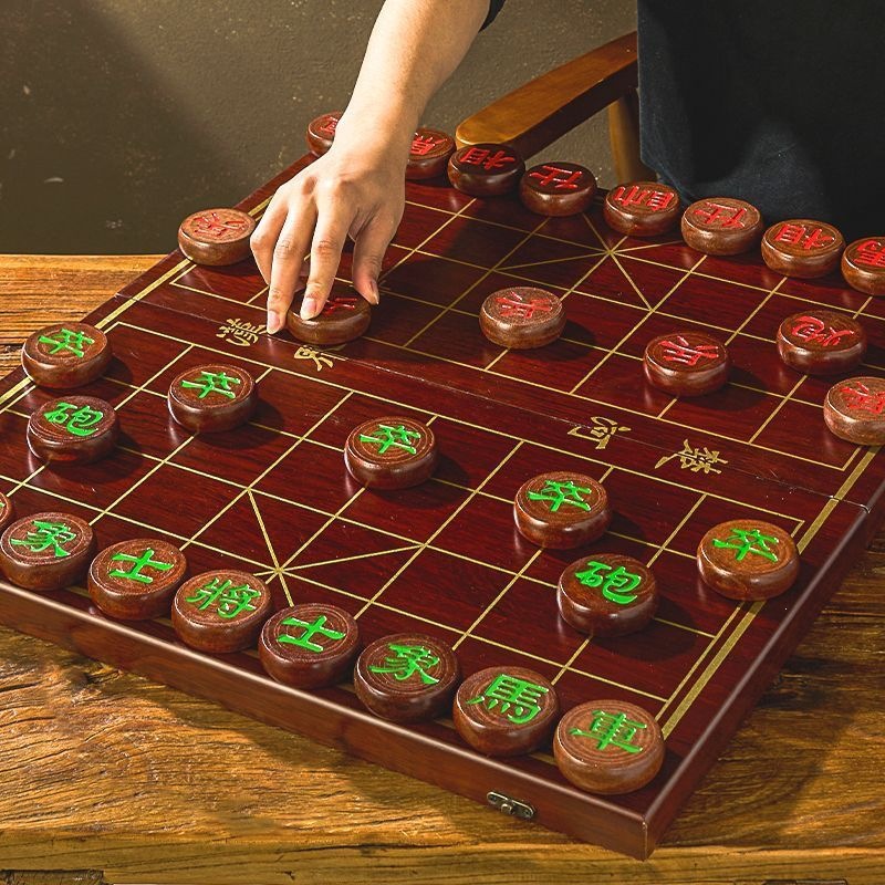 Solid wood Chinese chess set with a chessboard, suitable for both children and adults, a high-end and portable gift option, featuring original wood pieces