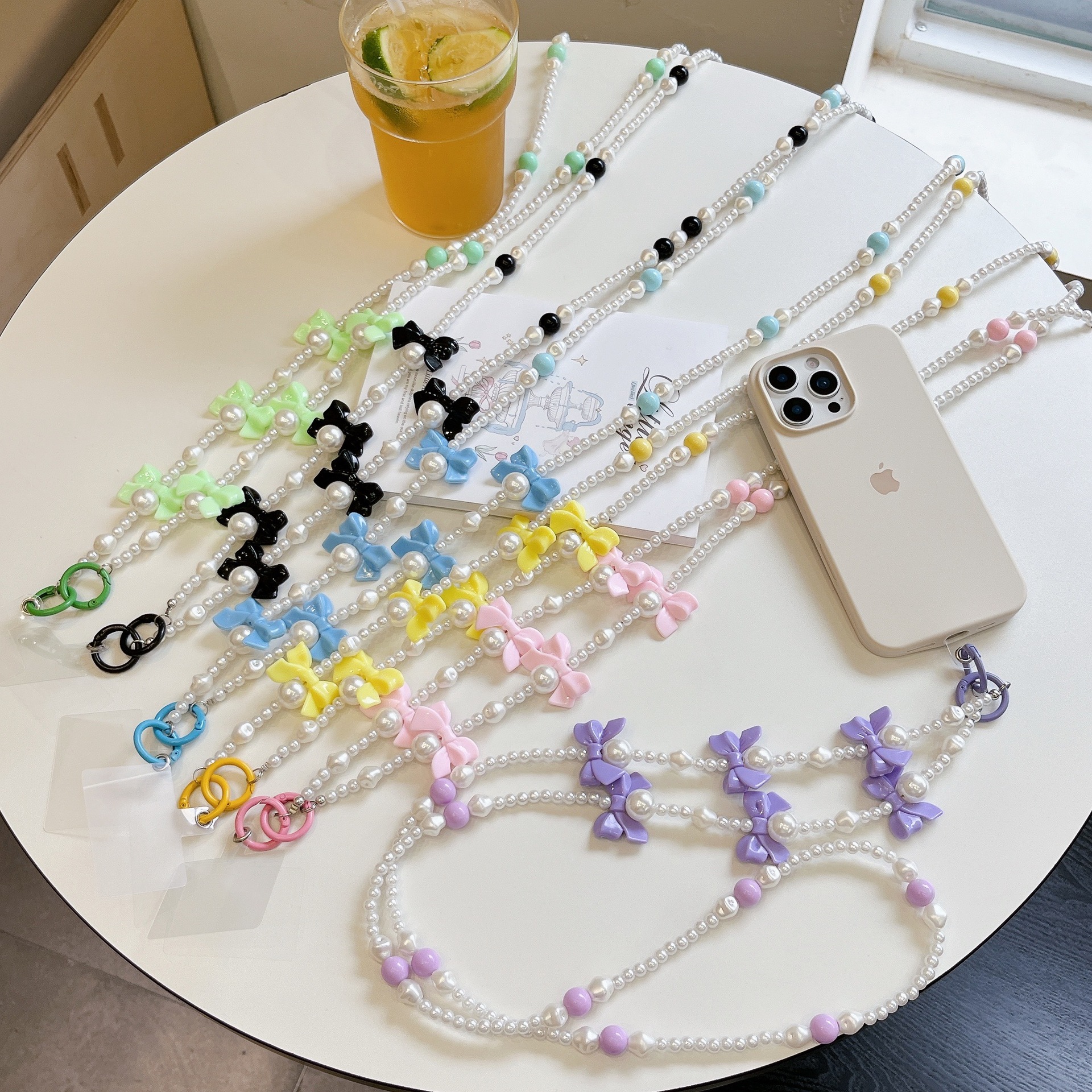 Verano color bowknot largo cadena de mensajero perla todo-fósforo bolso cadena larga cordón de teléfono móvil Xiaoqing aire fresco transfronterizo