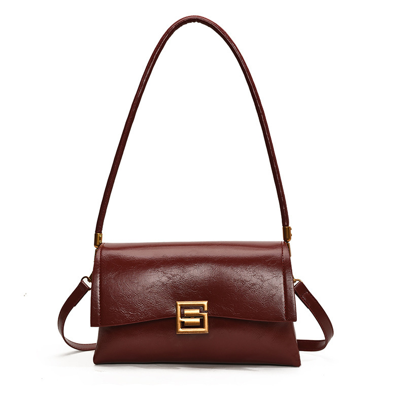 Bolso de axila de moda de lujo ligero de alta gama para mujer 2024 otoño e invierno nuevo nicho retro todo fósforo bolso de mensajero de un solo hombro