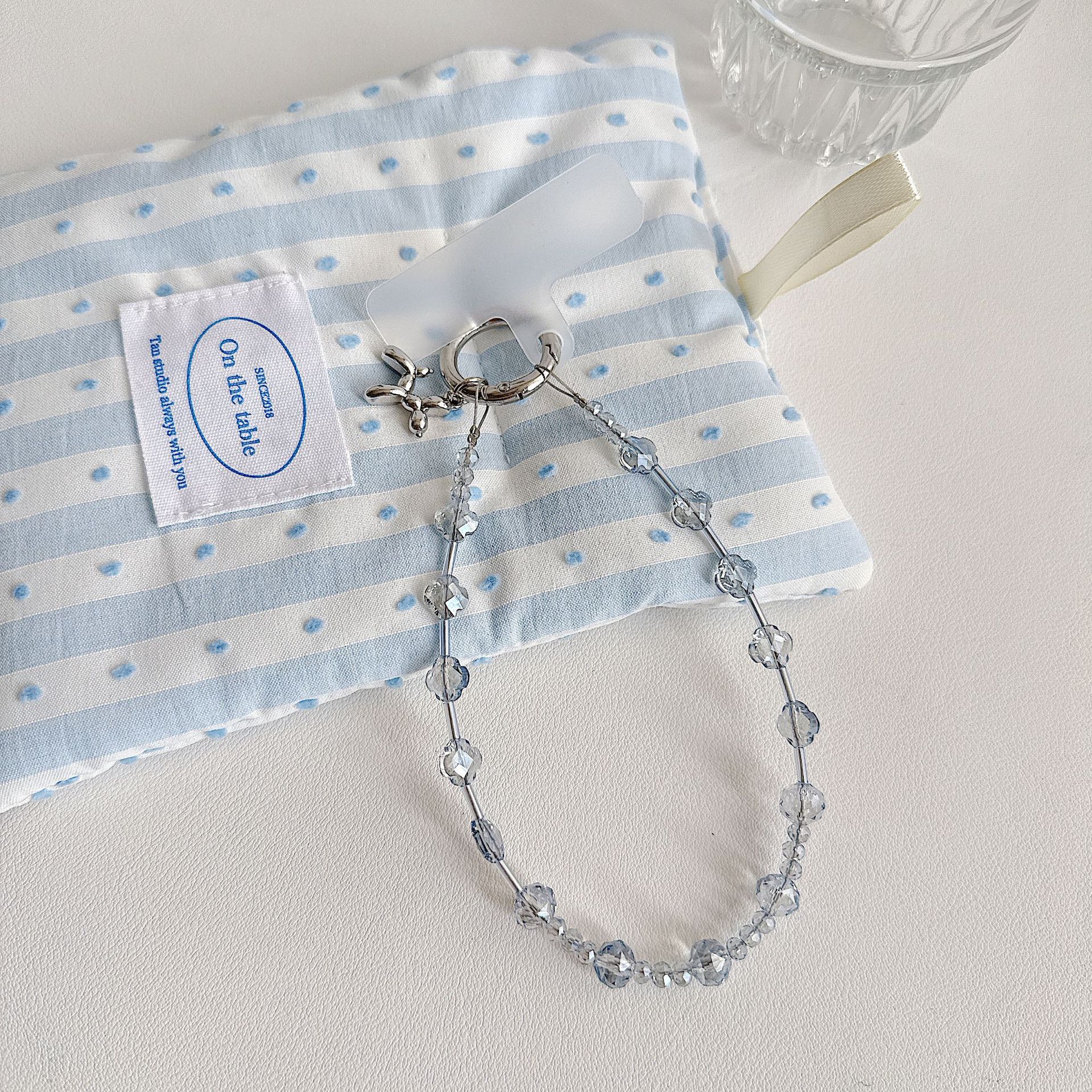 Boutique hecho a mano de alta gama para teléfono móvil cadena de muñeca de trébol de cuatro hojas de cristal original cadena de teléfono móvil de moda cuerda corta