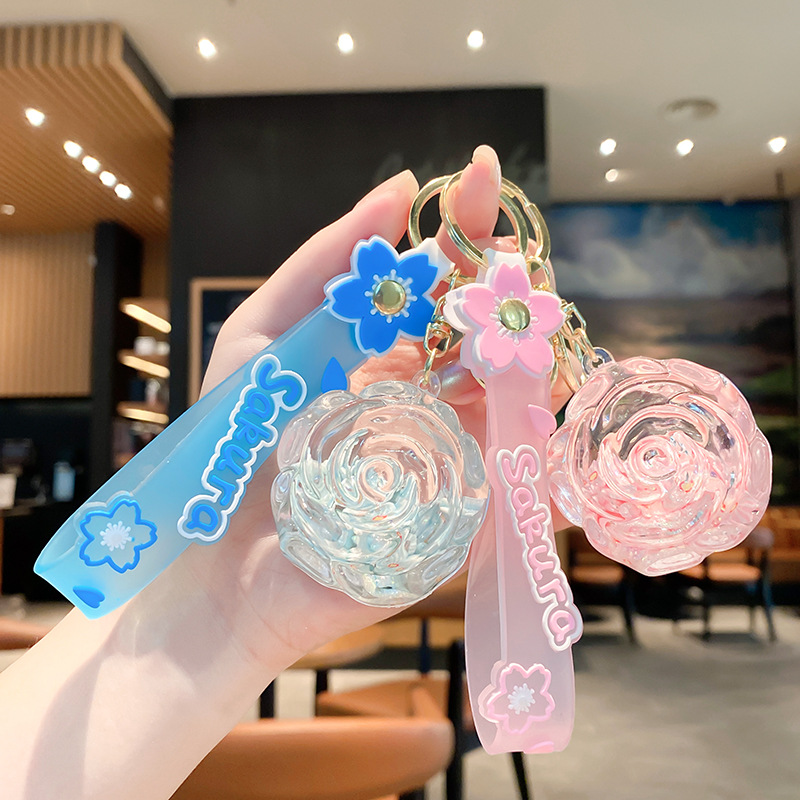 Llavero de rosa de aceite creativo lindo líquido arenas movedizas colgantes pequeños bolsos accesorios pareja pequeños regalos al por mayor