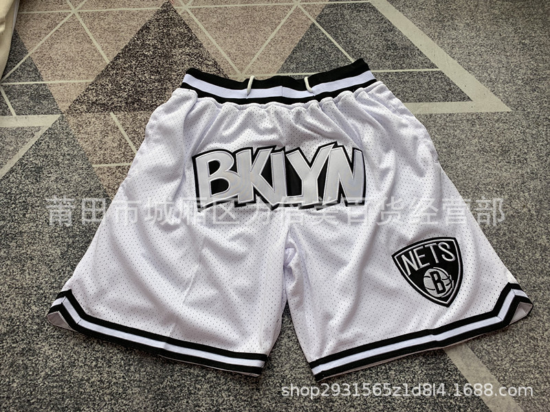 Comercio exterior pantalones de fútbol al por mayor Warriors Lakers 76 caliente Raptor mágico bolsillo bordado pantalones cortos pantalones de baloncesto NFL