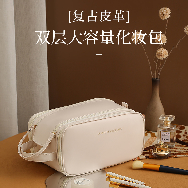 女性のための化粧品バッグ 2025 新しいポータブル大容量トラベルトイレタリーバッグライト高級ハイエンド化粧品パーティション収納袋|undefined