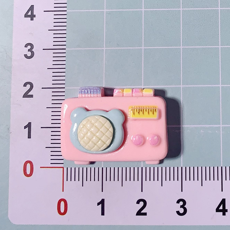 Nuevos dibujos animados brillante cara rosa osos joyería caja de teléfono celular agujero agujero cordón de cabeza de zapato DIY accesorios de resina de pegamento de crema