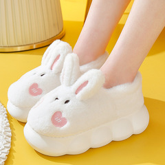 綿のスリッパの女性の厚い底の全包みと家庭用のかわいいぬいぐるみのウサギのスリッパの冬は厚くて暖かい月子の綿の靴の外で着ます。