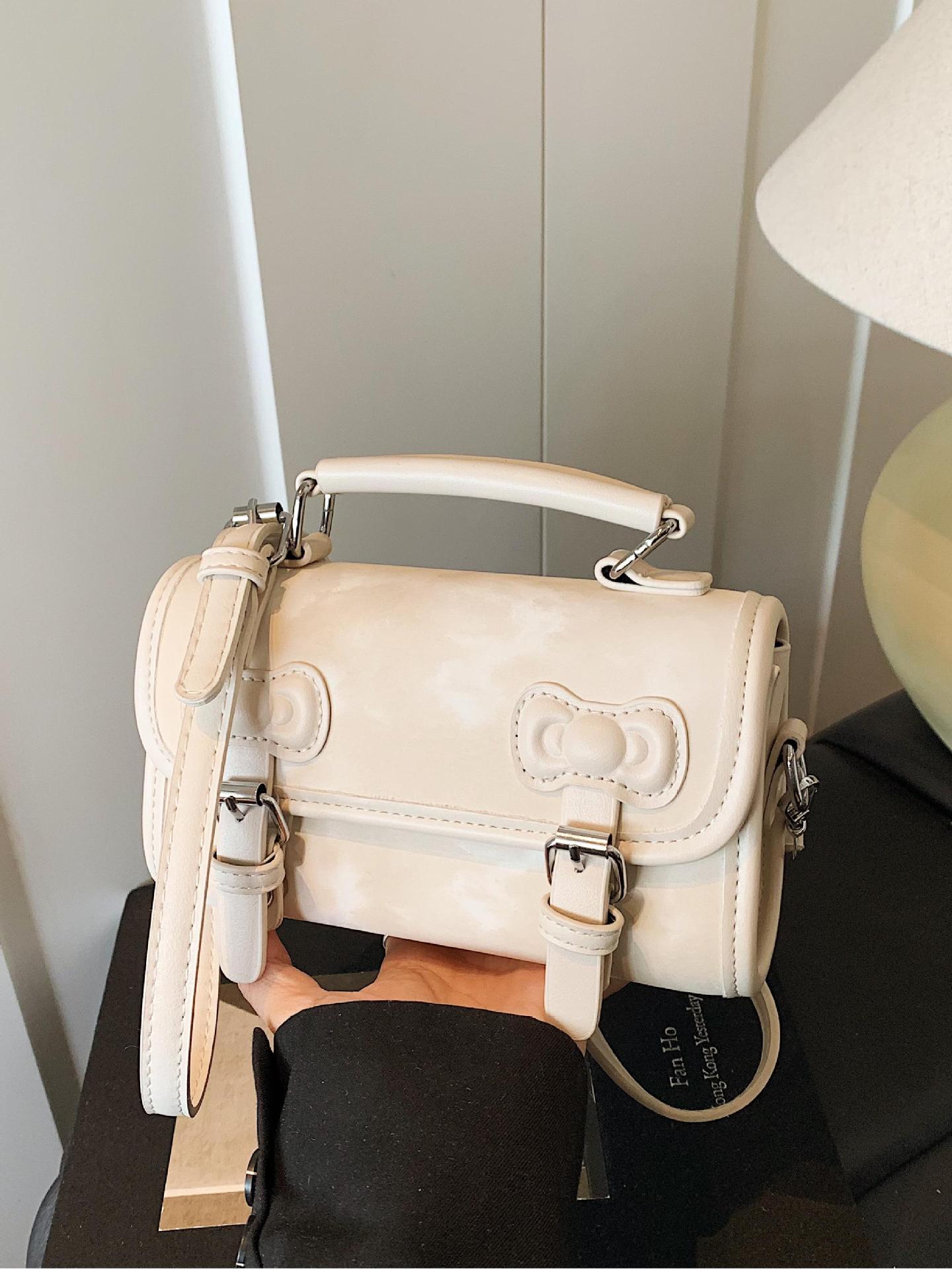 Summer Super Fire Hand lleva un pequeño bolso cuadrado femenino 2025 nuevo bolso de hombro con lazo de moda bolso de mensajero de estilo universitario de todo fósforo