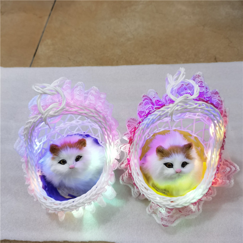 シミュレーション花かご猫は猫動物シミュレーション毛皮の置物観光地区の露店で子供のおもちゃのプレゼントを販売します。|undefined
