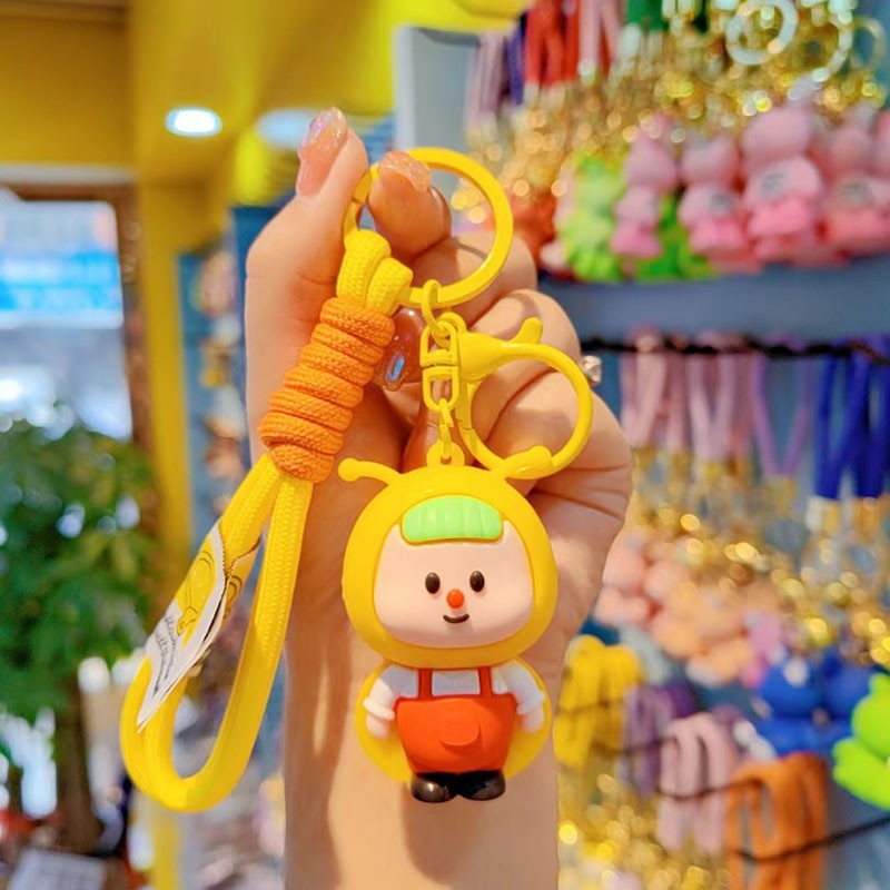 lindos dibujos animados luciérnagos llavero rojo estereoscópico muñeca de goma suave colgante de alto valor de la cara brillante pareja colgante